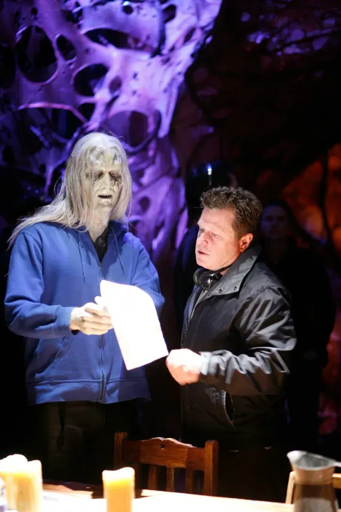 Behind the scenes on Stargate: Atlantis Todd the wraith talks script with director Brenton Spencer before retiring to…